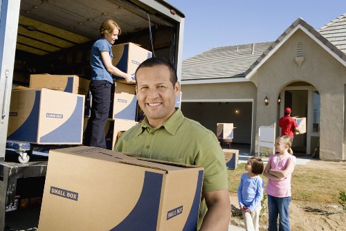 Movers using protective materials during packing services in Vauxhall